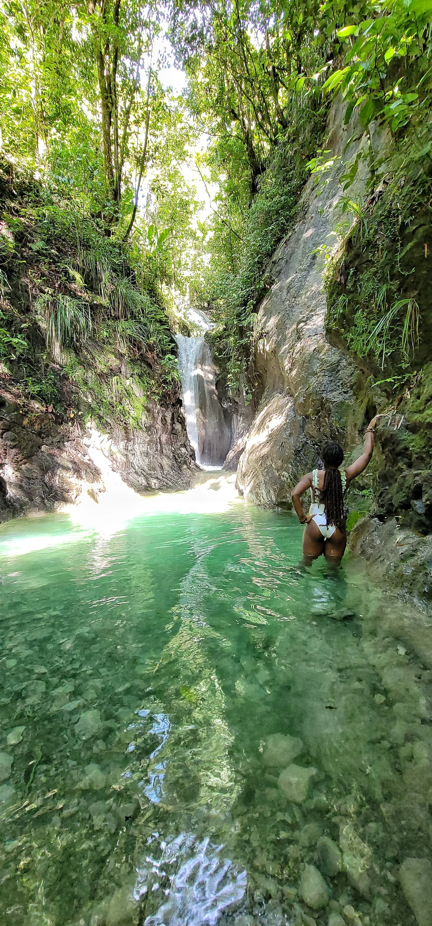 Clear gorge pool with waterfall